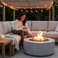Pompton 42 In. round Concrete Composite Propane Fire Pit in Fog with Vinyl Cover — Lifestyle